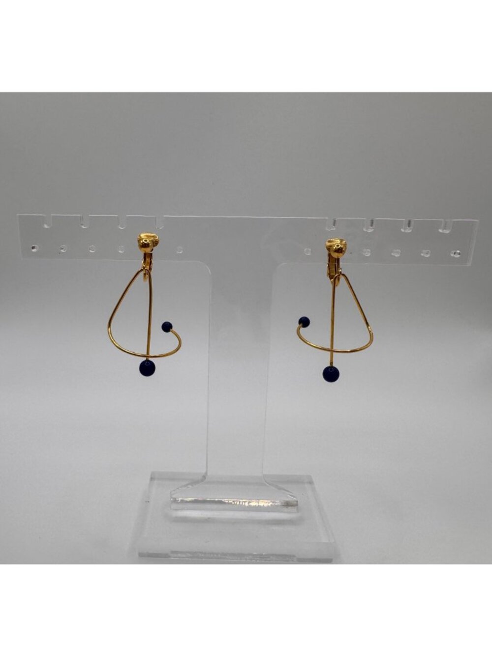 Avon Spiral Motion Modernist Earrings Gold Tone Blue Bead Dangle 1990s Clip On